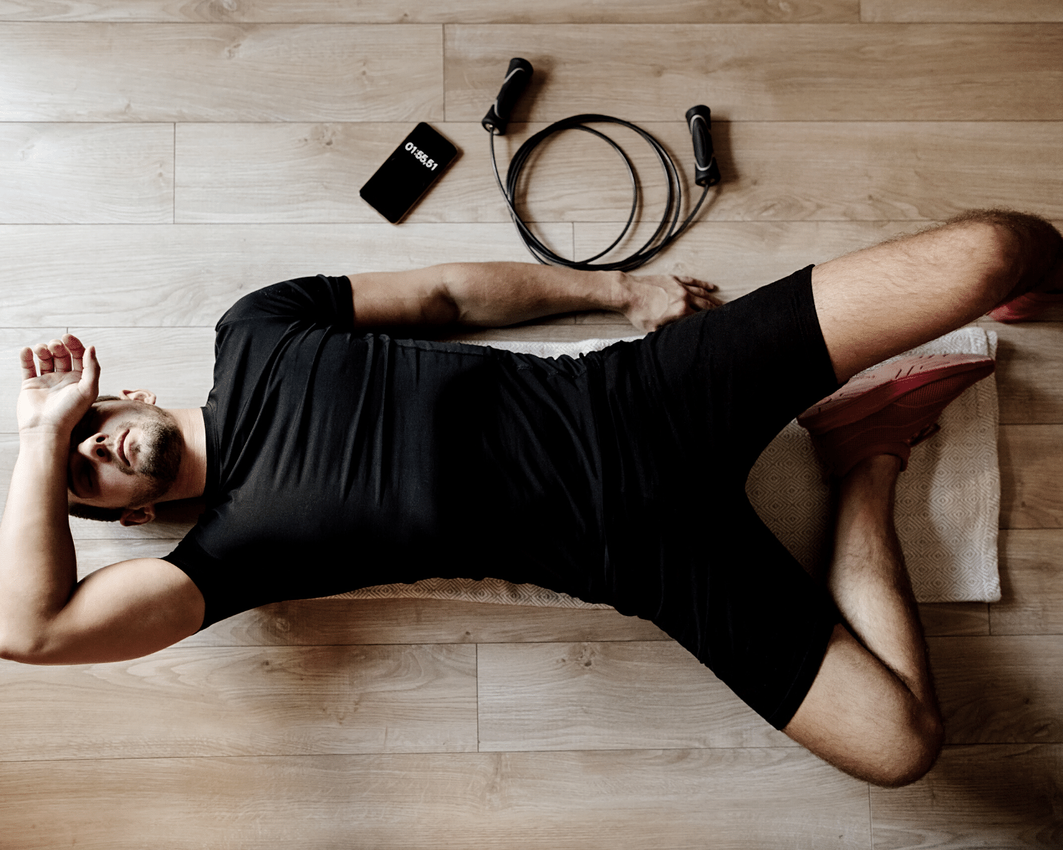 Fatigued athlete lying on floor