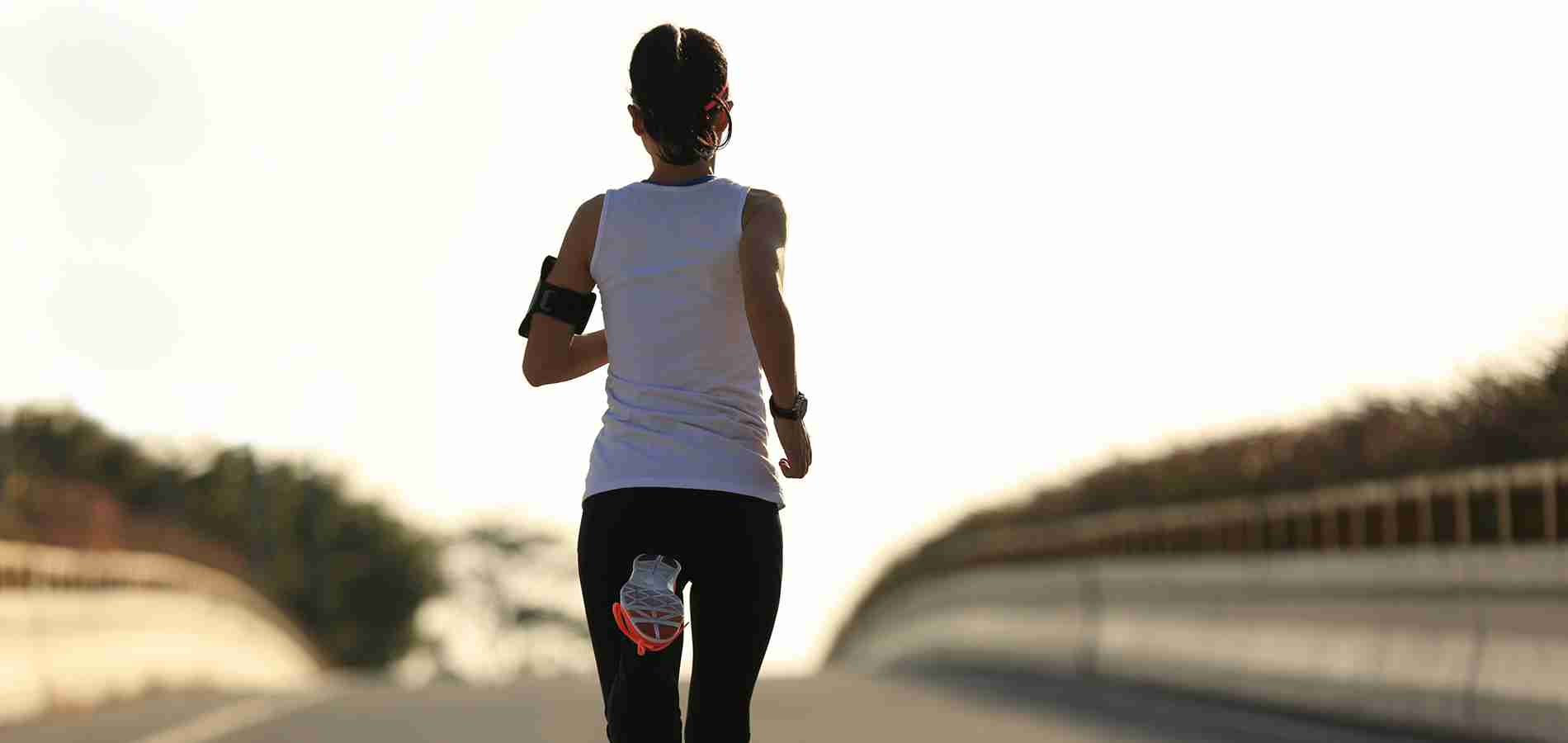 Female runner moving away from camera